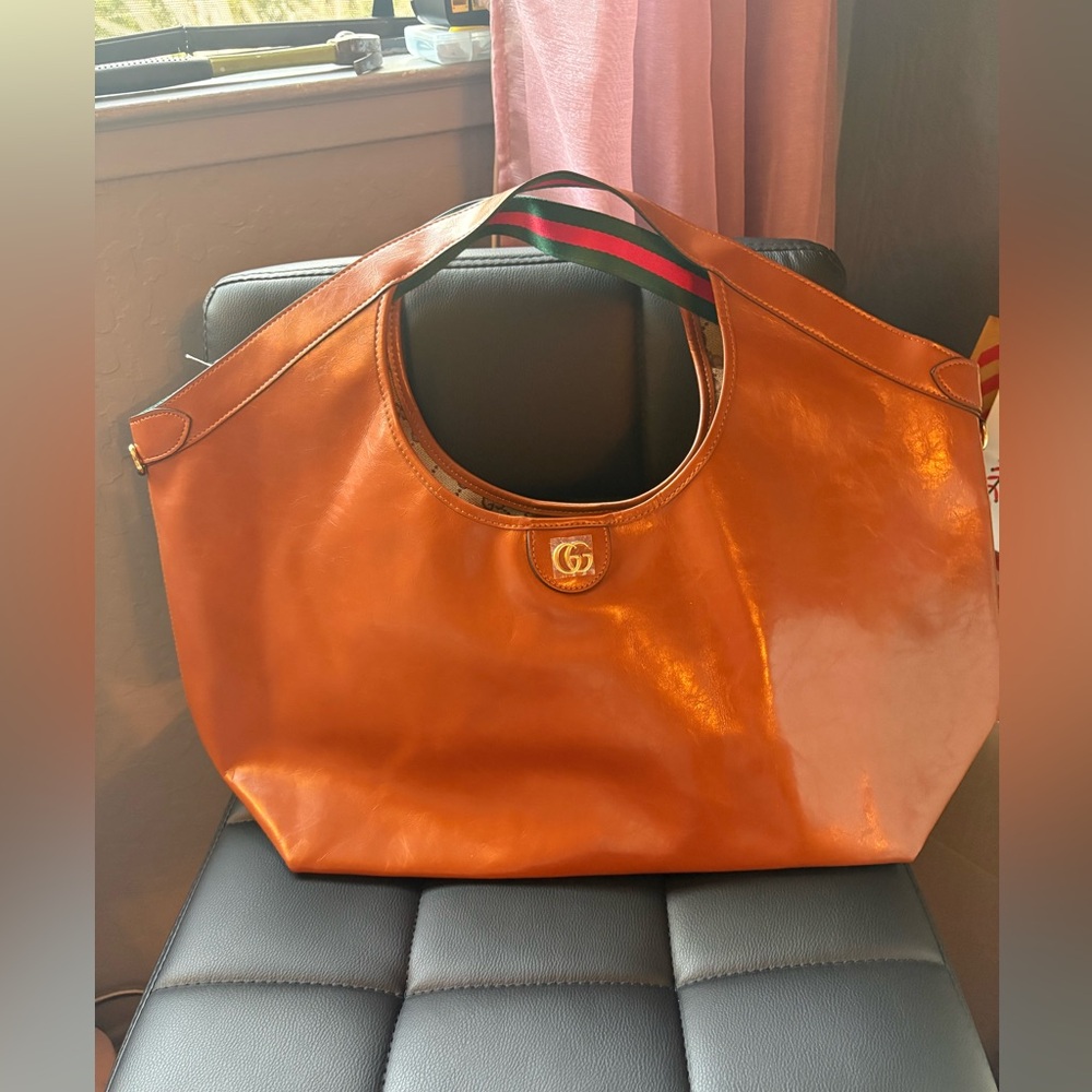 New. Brown leather gigolo tote.